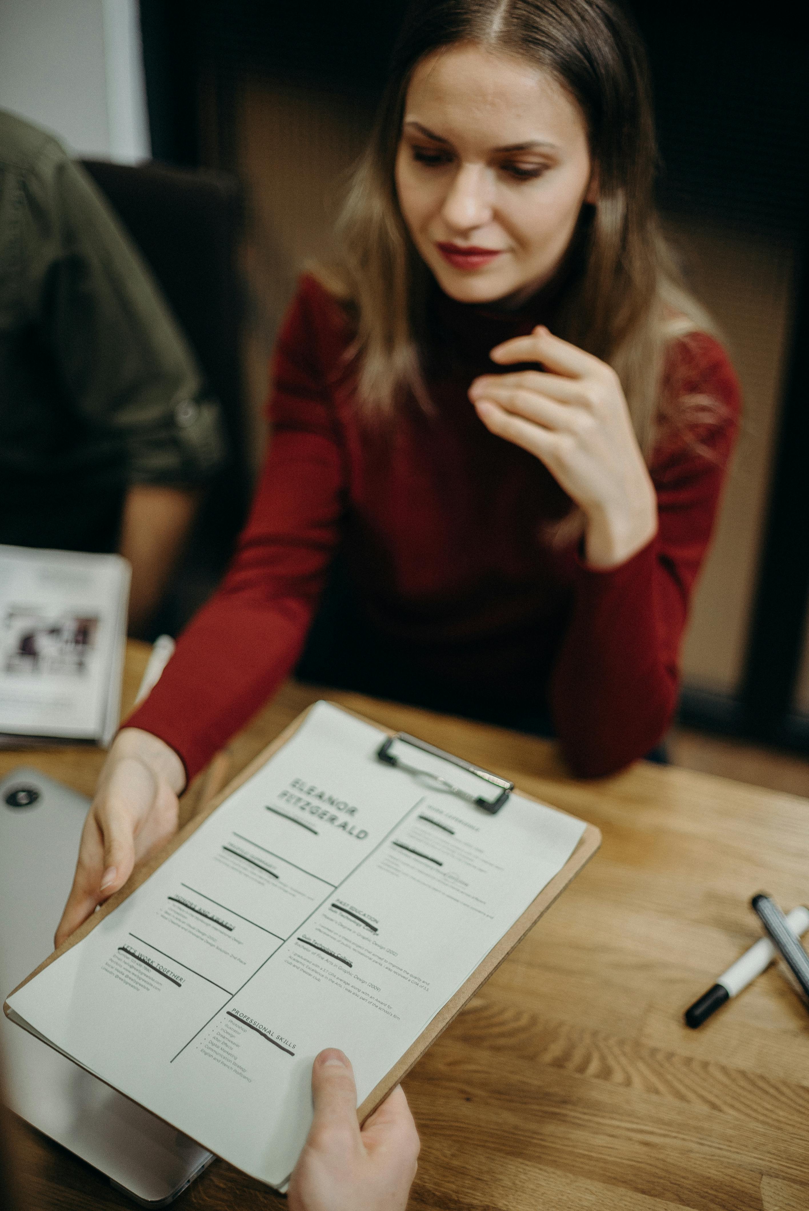 Candidate resume being reviewed during a recruitment discussion